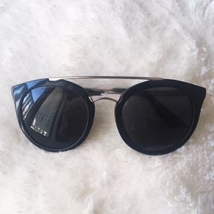 PRADA: Black Round Cateye Cinema Sunglasses-W/Case